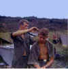 Meeks getting haircut from unidentified buddy